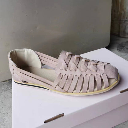 Nora- Sandalias planas de piel trenzada